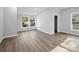 Well-lit bedroom featuring hardwood floors and multiple windows at 709 Bringle Ferry Rd, Salisbury, NC 28144
