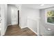 Bright hallway with hardwood floors and access to a full bathroom at 709 Bringle Ferry Rd, Salisbury, NC 28144