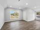 Spacious bedroom with hardwood floors and large windows offering natural light at 709 Bringle Ferry Rd, Salisbury, NC 28144