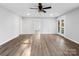 Large living room with hardwood floors and access to the front porch at 709 Bringle Ferry Rd, Salisbury, NC 28144