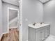 Laundry room with double vanity and access to the staircase at 709 Bringle Ferry Rd, Salisbury, NC 28144