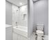 Clean bathroom with a white bathtub and marble tile at 709 Bringle Ferry Rd, Salisbury, NC 28144