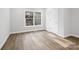 Bright bedroom with hardwood floors and a large window at 709 Bringle Ferry Rd, Salisbury, NC 28144