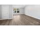 Large bedroom with hardwood floors, a closet, and a window at 709 Bringle Ferry Rd, Salisbury, NC 28144