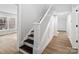 Clean staircase with white railing and dark wood steps at 709 Bringle Ferry Rd, Salisbury, NC 28144
