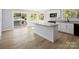 Modern kitchen with island, granite countertops and white cabinets at 709 Bringle Ferry Rd, Salisbury, NC 28144