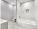 Clean bathroom with a bathtub and marble tile at 709 Bringle Ferry Rd, Salisbury, NC 28144