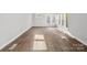 Bright living room featuring hardwood floors and large windows at 709 Bringle Ferry Rd, Salisbury, NC 28144