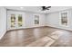 Bright and spacious living room with hardwood floors and french doors at 709 Bringle Ferry Rd, Salisbury, NC 28144