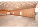 Large, unfinished basement space with concrete floors and framed walls at 4916 Southview Dr, Hickory, NC 28602