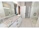 Modern bathroom featuring a granite countertop, white cabinets, and a glass shower at 4916 Southview Dr, Hickory, NC 28602