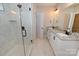 Elegant bathroom with dual vanities, walk-in shower, and marble tile floor at 4916 Southview Dr, Hickory, NC 28602