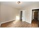 Bright bedroom with open closet and wood-look flooring at 4916 Southview Dr, Hickory, NC 28602