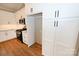 White kitchen cabinets, granite countertops, stainless steel appliances, and a convenient pantry at 4916 Southview Dr, Hickory, NC 28602