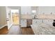 Modern kitchen with white cabinets, granite countertops, and stainless steel appliances at 4916 Southview Dr, Hickory, NC 28602