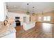 Modern kitchen with white cabinets, granite countertop island, and stainless steel appliances, open to the living area at 4916 Southview Dr, Hickory, NC 28602