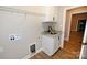 Laundry room with white cabinets, granite countertop, sink, and washer/dryer hookups at 4916 Southview Dr, Hickory, NC 28602