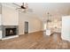 Open living room featuring a fireplace and kitchen with island at 4916 Southview Dr, Hickory, NC 28602