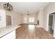 Open-concept living area with wood floors, fireplace, and lots of natural light at 4916 Southview Dr, Hickory, NC 28602