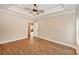 Large main bedroom with wood floors, tray ceiling, and neutral paint at 4916 Southview Dr, Hickory, NC 28602