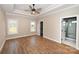 Spacious main bedroom with wood floors, tray ceiling, and ensuite bathroom at 4916 Southview Dr, Hickory, NC 28602
