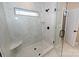 Modern shower with white marble tile, a built-in bench, and black fixtures at 4916 Southview Dr, Hickory, NC 28602