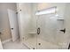 Walk-in shower with white marble tile, a built-in seat, and black fixtures at 4916 Southview Dr, Hickory, NC 28602