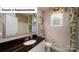 Bathroom with vanity, toilet and shower/tub combo at 5072 Silver Creek Ln, Denver, NC 28037