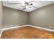 Simple basement bedroom with wood flooring and ceiling fan at 7754 Long Bay Pkwy, Catawba, NC 28609