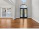 Bright entryway with double doors, hardwood floors, and large window at 7754 Long Bay Pkwy, Catawba, NC 28609