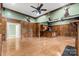 Spacious game room with hardwood floors, wood paneling, and a bar area at 7754 Long Bay Pkwy, Catawba, NC 28609