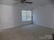 Spacious bedroom with carpeted floor and window coverings at 141 Rock Ridge Ln, Mount Holly, NC 28120