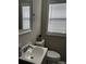 Small bathroom with vanity, toilet, and window with blinds at 810 N Woodland Dr, Lancaster, SC 29720