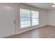 Living room featuring hardwood floors and large window at 4605 Coronado Dr # M, Charlotte, NC 28212