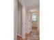 Bright hallway with light wood flooring and doors to other rooms at 4605 Coronado Dr # M, Charlotte, NC 28212