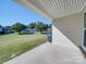 Covered patio overlooking grassy backyard at 4605 Coronado Dr # M, Charlotte, NC 28212