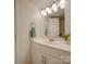 Bathroom with vanity, mirror, and white cabinets at 4605 Coronado Dr # M, Charlotte, NC 28212