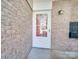 White door with storm door and brick wall at 4605 Coronado Dr # M, Charlotte, NC 28212