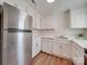 Modern kitchen with white cabinets and stainless steel appliances at 4605 Coronado Dr # M, Charlotte, NC 28212