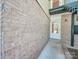 Brick building exterior with a white door at 4605 Coronado Dr # M, Charlotte, NC 28212