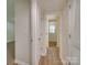 Hallway with light walls and wood-look flooring at 4605 Coronado Dr # M, Charlotte, NC 28212