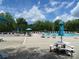 Community swimming pool with lounge chairs and picnic tables at 2253 Iron Works Dr, Clover, SC 29710