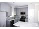 Modern kitchen with gray shaker cabinets, quartz countertops, and stainless steel appliances at 1022 W C St, Kannapolis, NC 28081