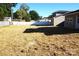 Large backyard with straw ground cover and a new home at 1022 W C St, Kannapolis, NC 28081