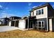 Modern two-story townhouses with gray siding, white garage doors, and neutral colors at 1022 W C St, Kannapolis, NC 28081