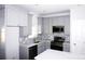 Modern kitchen with gray shaker cabinets, quartz countertops, and stainless steel appliances at 1022 W C St, Kannapolis, NC 28081
