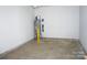 Unfinished garage with plumbing and space for storage at 1022 W C St, Kannapolis, NC 28081