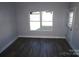Spacious bedroom with wood-look floors and exterior access at 1022 W C St, Kannapolis, NC 28081
