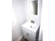 Small bathroom with white vanity, sink, and mirror at 1022 W C St, Kannapolis, NC 28081