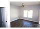 Bright bedroom with wood-look floors, ceiling fan, and large window at 1022 W C St, Kannapolis, NC 28081